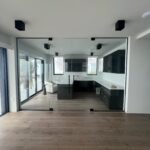 Glass-walled modern kitchen and office