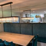 Crystal rectangular pendant lights over wooden dining table