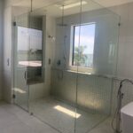 Glass walk-in shower with ocean view