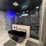 Modern bathroom with black freestanding tub