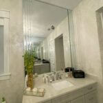 White bathroom vanity with mirror and sink