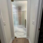 Hallway with frosted textured glass door