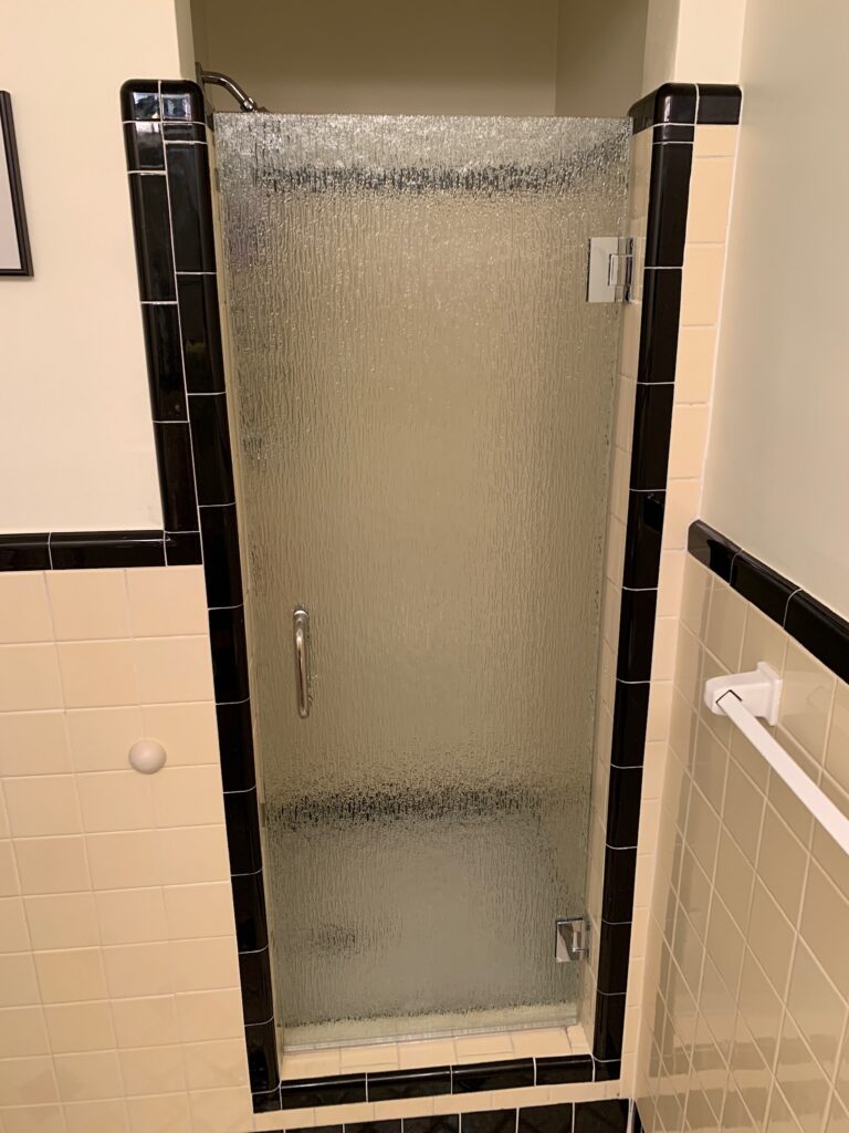 Frosted glass shower door with black trim