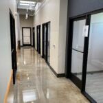 Modern office hallway with glass doors