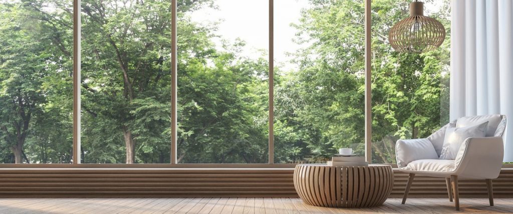 Minimal living room with panoramic forest view